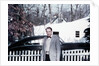 Mature man in front of 1940s car, ca. 1950 by Anonymous