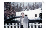 Mature man in front of 1940s car, ca. 1950 by Anonymous