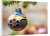 Close-up of a decorated hanging bauble against blurred background by Anonymous