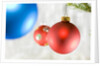 Close-up of hanging red and blue Christmas baubles by Anonymous