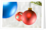 Close-up of hanging red and blue Christmas baubles by Anonymous