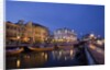 Moliceiro boats docked by Art Nouveau style buildings along the Central Canal by Anonymous