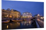 Moliceiro boats docked by Art Nouveau style buildings along the Central Canal by Anonymous