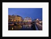 Moliceiro boats docked by Art Nouveau style buildings along the Central Canal by Anonymous