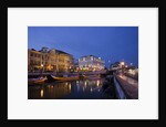 Moliceiro boats docked by Art Nouveau style buildings along the Central Canal by Anonymous