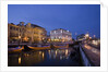 Moliceiro boats docked by Art Nouveau style buildings along the Central Canal by Anonymous