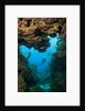 Diver seen through opening in coral reef by Anonymous