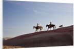 Cowgirls and dogs along the ridge of The Painted Hills by Anonymous