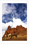 Riders passing under the Red Rock Hills of the Big Horn Mountains by Anonymous