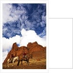 Riders passing under the Red Rock Hills of the Big Horn Mountains by Anonymous