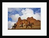 Riders passing under the Red Rock Hills of the Big Horn Mountains by Anonymous