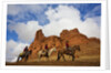 Riders passing under the Red Rock Hills of the Big Horn Mountains by Anonymous