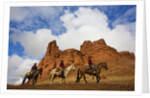 Riders passing under the Red Rock Hills of the Big Horn Mountains by Anonymous