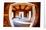 Cowgirl in doorway of old cabin by Anonymous