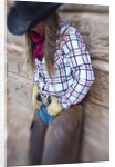 Cowgirl outside cabin by Anonymous