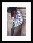 Cowgirl outside cabin by Anonymous