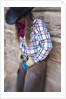 Cowgirl outside cabin by Anonymous
