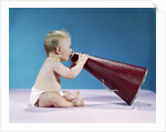 1960s Profile Of Seated Baby Shouting Yelling Speaking Into Big Megaphone by Anonymous