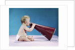 1960s Profile Of Seated Baby Shouting Yelling Speaking Into Big Megaphone by Anonymous