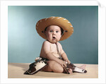 1960s Baby Wearing Cowboy Costume With Funny Facial Expression Looking At Camera by Anonymous
