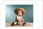 1960s Baby Wearing Cowboy Costume With Funny Facial Expression Looking At Camera by Anonymous