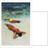 1990s Couple Sunbathing In Shallow Water At The Ocean's Edge by Anonymous