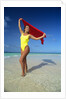 1990s Woman In Yellow Bathing Suit Holding Windblown Red Cloth Mopion Island, Grenadines, West Indies by Anonymous