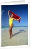 1990s Woman In Yellow Bathing Suit Holding Windblown Red Cloth Mopion Island, Grenadines, West Indies by Anonymous