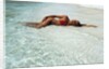 1990s Woman In Red Bikini Lying In Shallow Water On The Beach by Anonymous