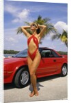 1980s Woman In Red Swimsuit In Front Of Red Sports Car by Anonymous