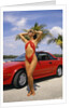 1980s Woman In Red Swimsuit In Front Of Red Sports Car by Anonymous