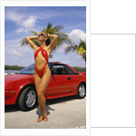 1980s Woman In Red Swimsuit In Front Of Red Sports Car by Anonymous