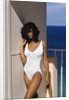 1990s Woman Wearing White Bathing Suit Looking At Camera by Anonymous
