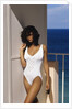 1990s Woman Wearing White Bathing Suit Looking At Camera by Anonymous