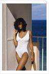 1990s Woman Wearing White Bathing Suit Looking At Camera by Anonymous