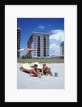 1990s Young Family On Beach Playing In The Sand by Anonymous