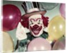 1950s Circus Clown Portrait Smiling Amid Balloons Pointing Up Looking At Camera by Anonymous