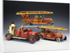 A Tipp and Company tinplate keywind overhead ladder fire engine with a Bing heavy tinplate fire pumper and a Gunthermann tinplate windup fire ladder truck by Anonymous