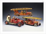 A Tipp and Company tinplate keywind overhead ladder fire engine with a Bing heavy tinplate fire pumper and a Gunthermann tinplate windup fire ladder truck by Anonymous