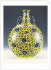 An underglaze blue and yellow enamelled moonflask with a peony and lotus pattern by Anonymous