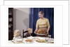 1960s Grandmother Presenting Roasted Turkey To Children At Dining Room Table by Anonymous