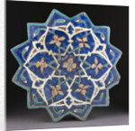 A Samarkand cuerda Seca stellar tile of twelve pointed form, the blue ground with a central turquoise and gold flower outlined in red by Anonymous