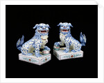 A pair of Kakiemon models of seated Karashishi by Anonymous