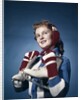 1960s Smiling Woman Wearing Red Mittens Ear Muff Blue Sweater Holding Ice Skates by Anonymous