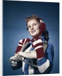 1960s Smiling Woman Wearing Red Mittens Ear Muff Blue Sweater Holding Ice Skates by Anonymous