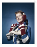1960s Smiling Woman Wearing Red Mittens Ear Muff Blue Sweater Holding Ice Skates by Anonymous