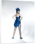 1960s Woman Looking Over Shoulder Wear Dance Costume Blue Sequined Top Hat Silk Tails Fishnet Seamed Stockings Looking At Camera by Anonymous