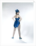 1960s Woman Looking Over Shoulder Wear Dance Costume Blue Sequined Top Hat Silk Tails Fishnet Seamed Stockings Looking At Camera by Anonymous