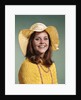 1970s Smiling Young Woman Wearing Yellow Floppy Brim Hat And Blouse With Pink Beads Looking At Camera by Anonymous