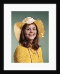 1970s Smiling Young Woman Wearing Yellow Floppy Brim Hat And Blouse With Pink Beads Looking At Camera by Anonymous